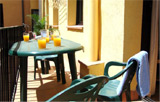 Balcony with table and chairs Barcelona Old Town Apartment 4 | Balcony